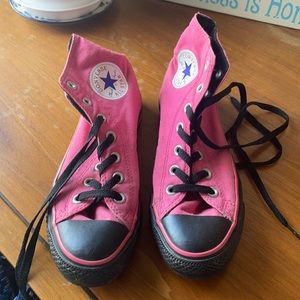 Pink and black high top converse